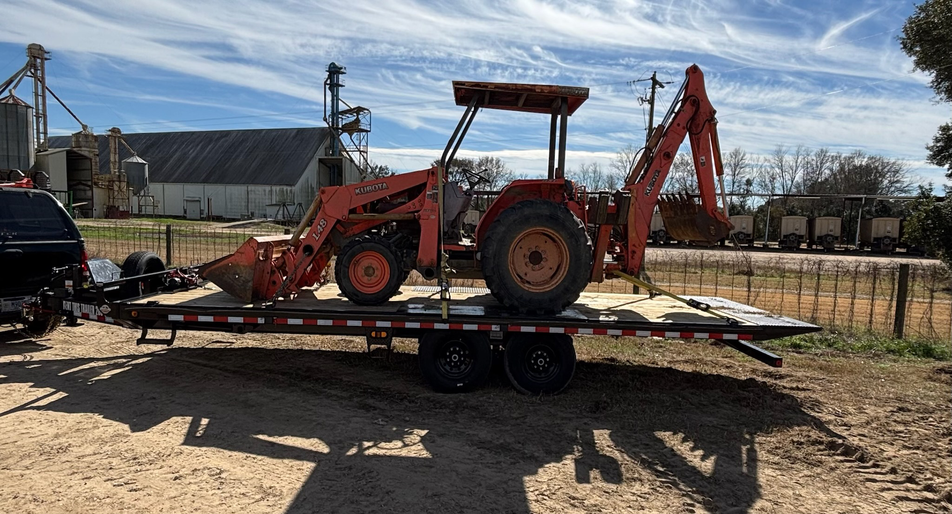 Construction equipment loaded on a trailer rental in Birmingham, AL.